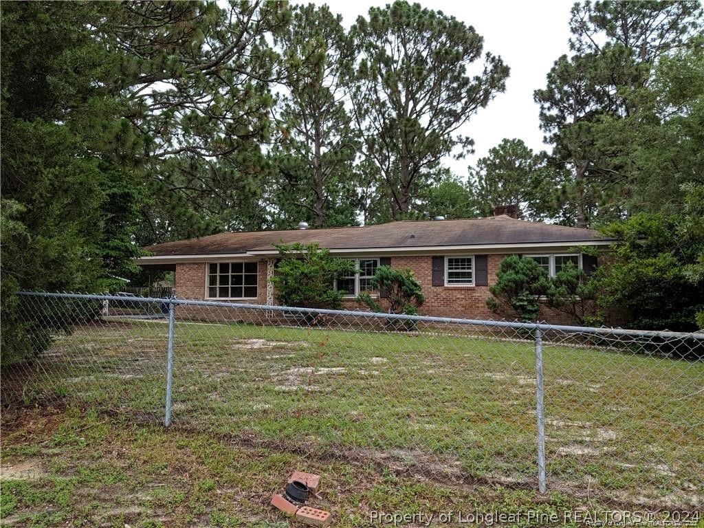 a front view of a house with swimming pool