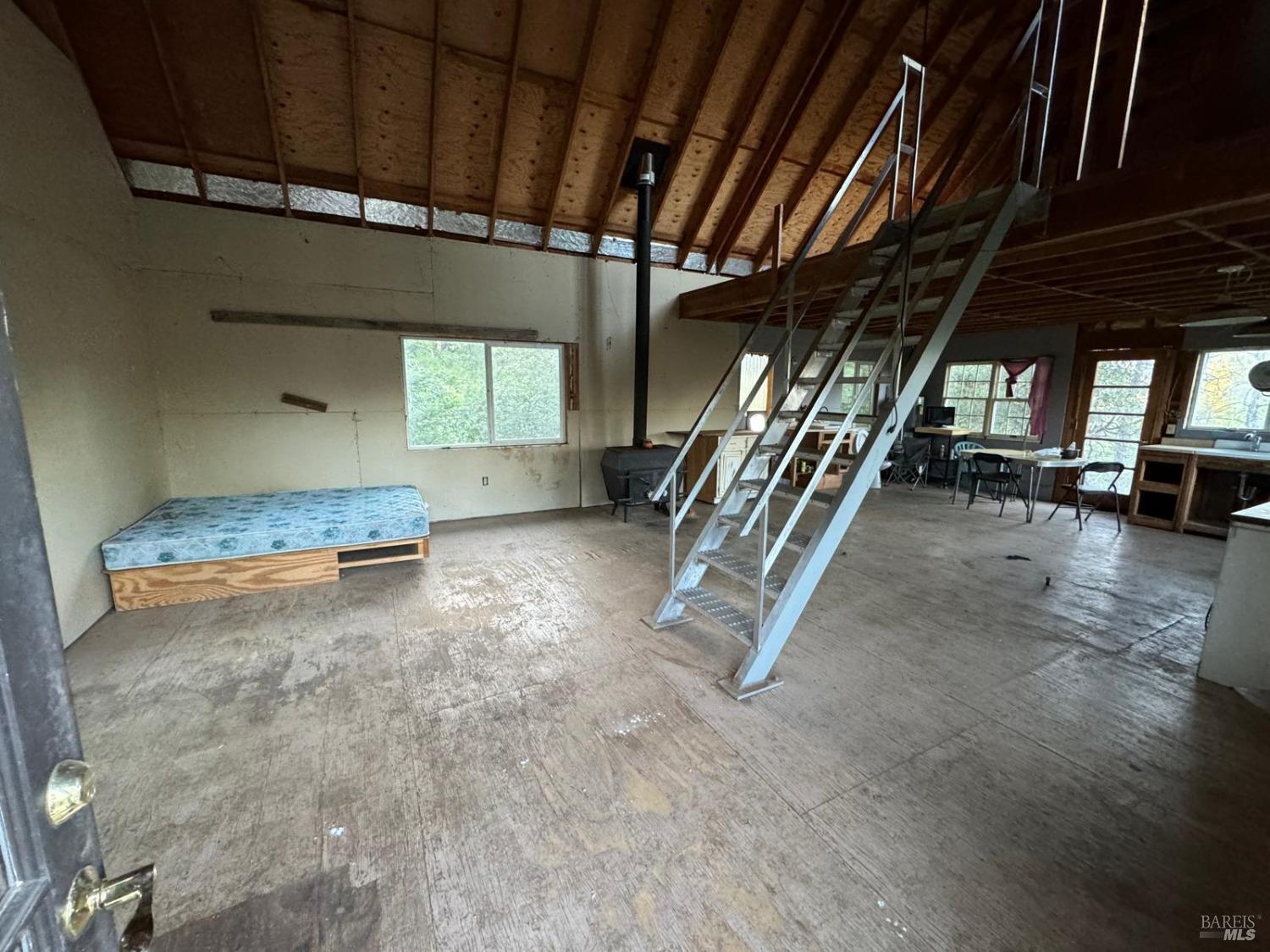 a view of outdoor space with wooden floor and windows