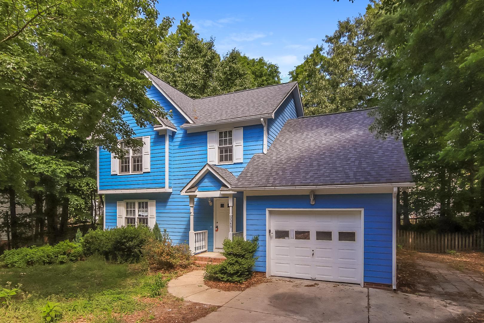 a front view of a house with garage