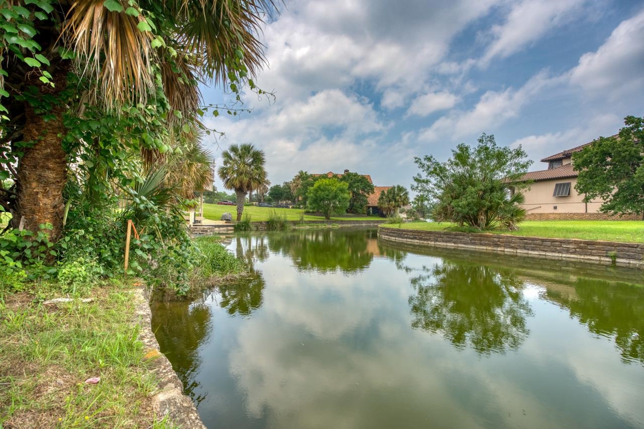 a view of a lake with a yard