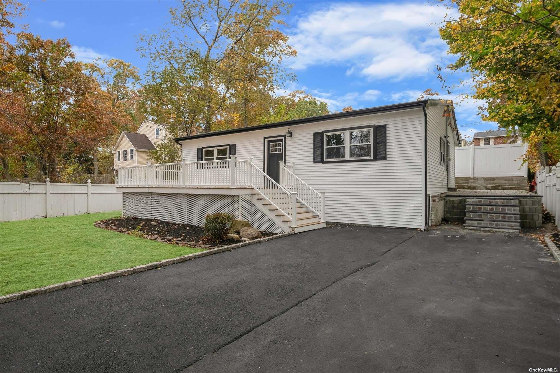 a view of house with a yard