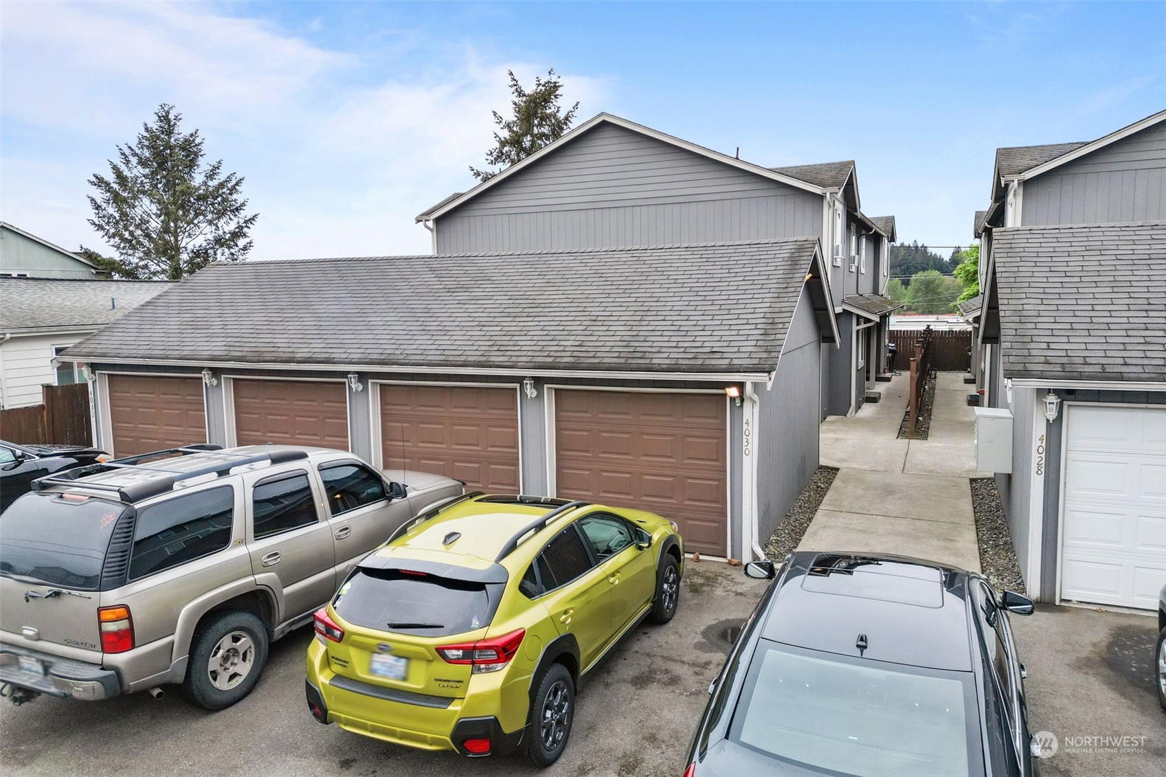 a front view of a house with parking space