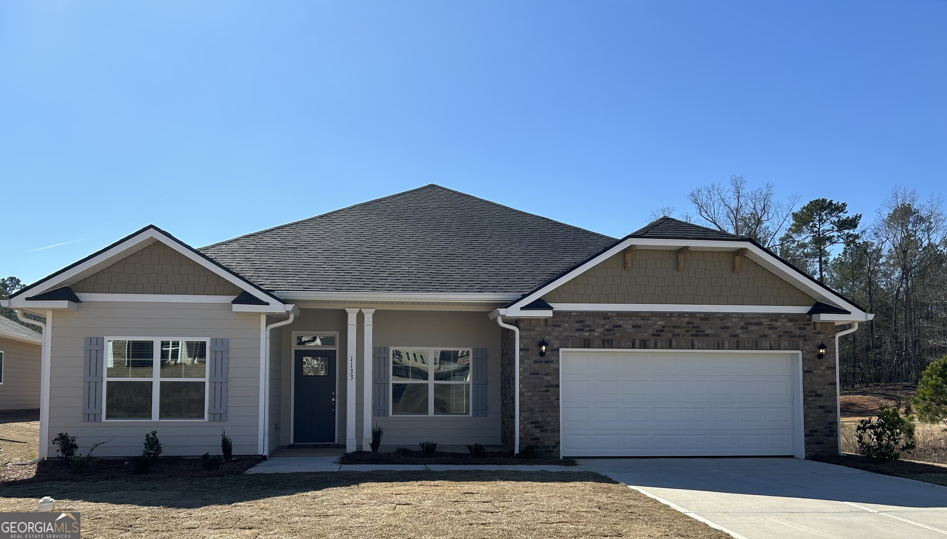 a front view of a house with a yard