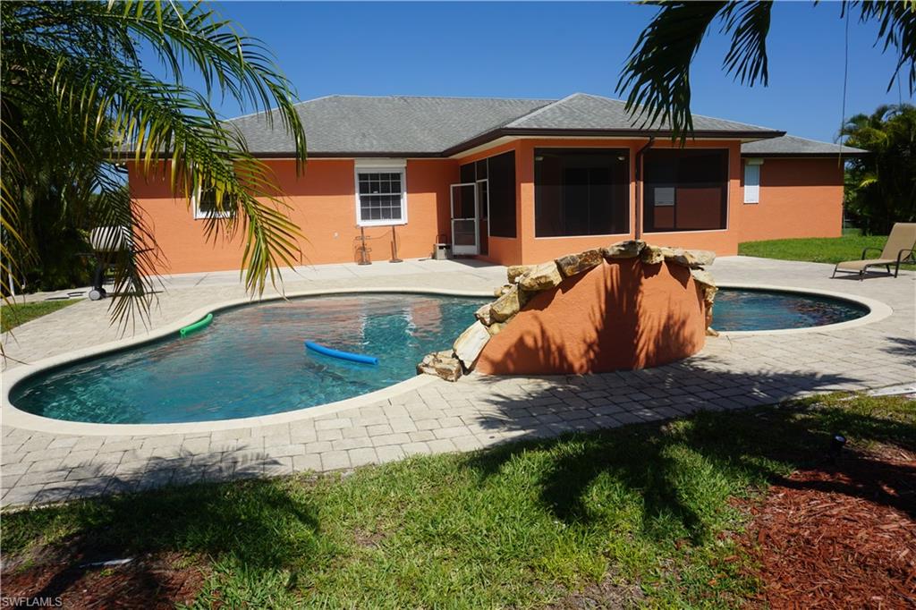 a view of outdoor space with swimming pool