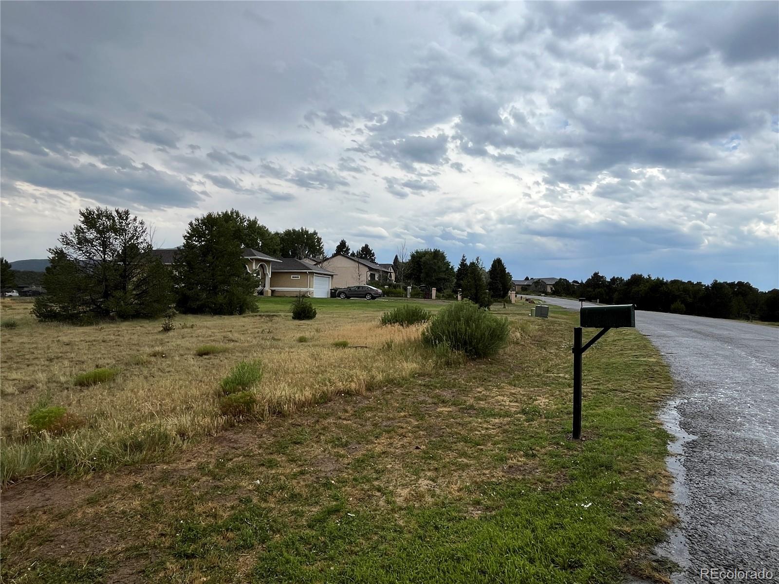 a view of a lake view with houses in back