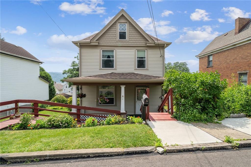 a front view of a house with a yard