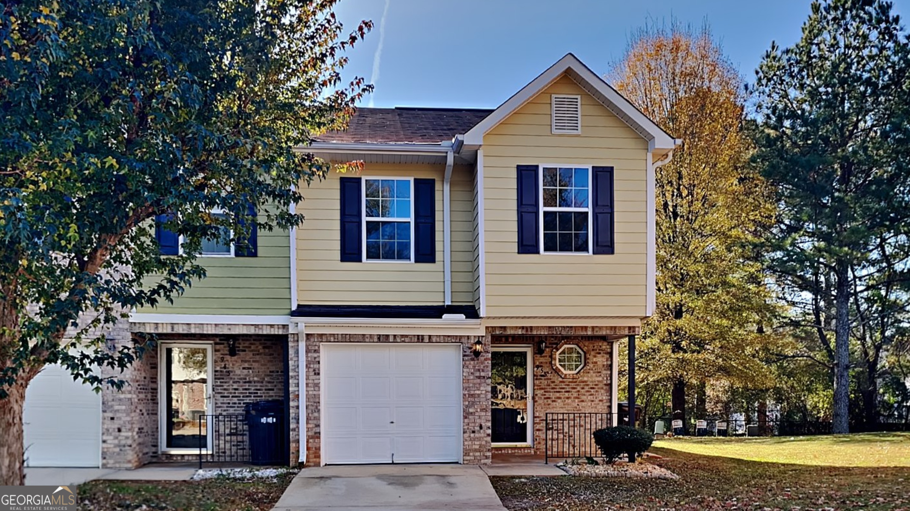 a front view of a house with a yard