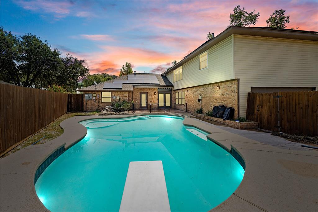 a view of a house with swimming pool