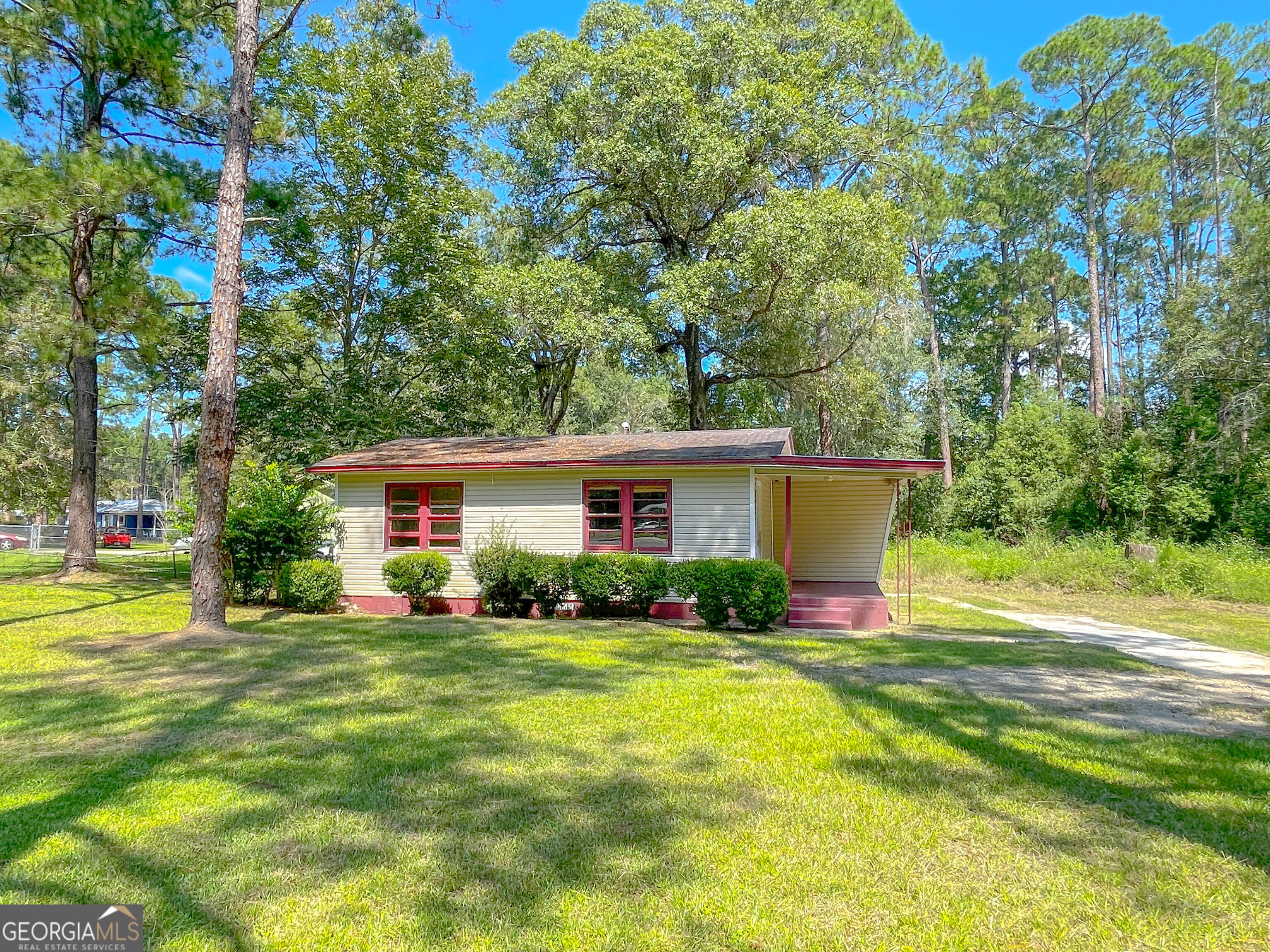 a front view of a house with garden