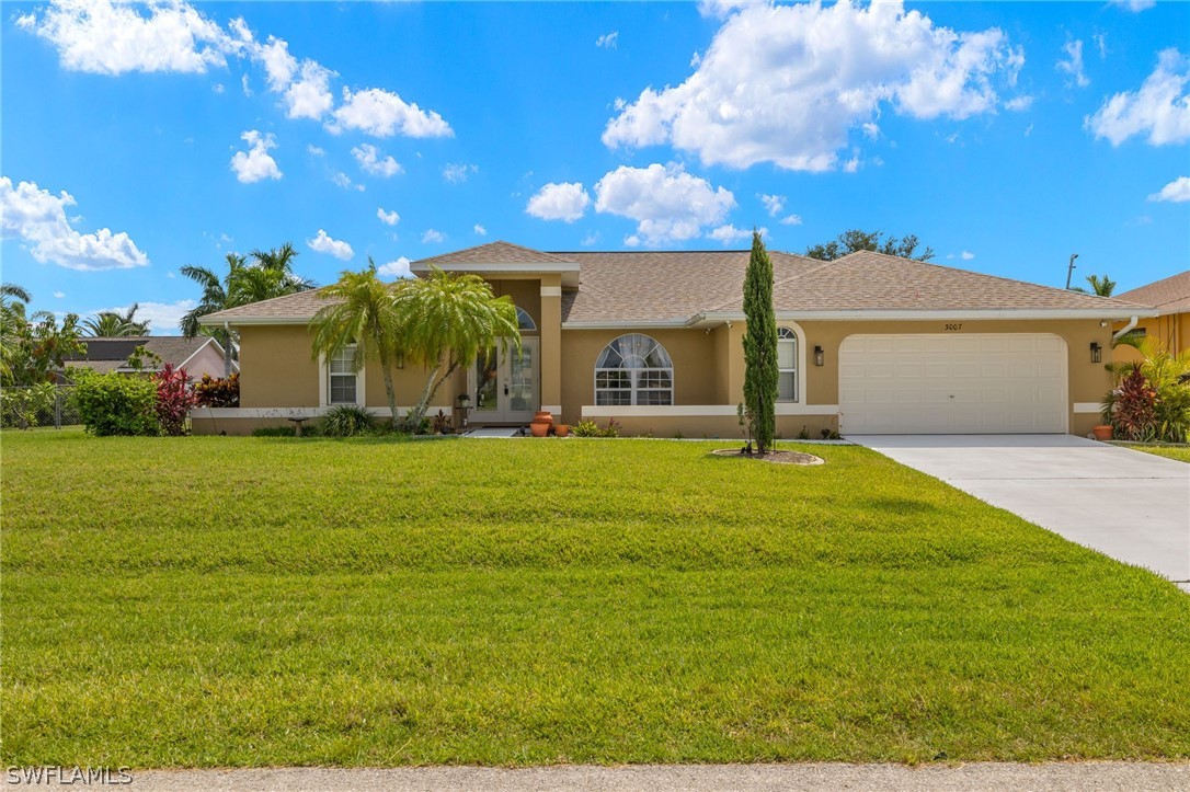 a front view of a house with a yard