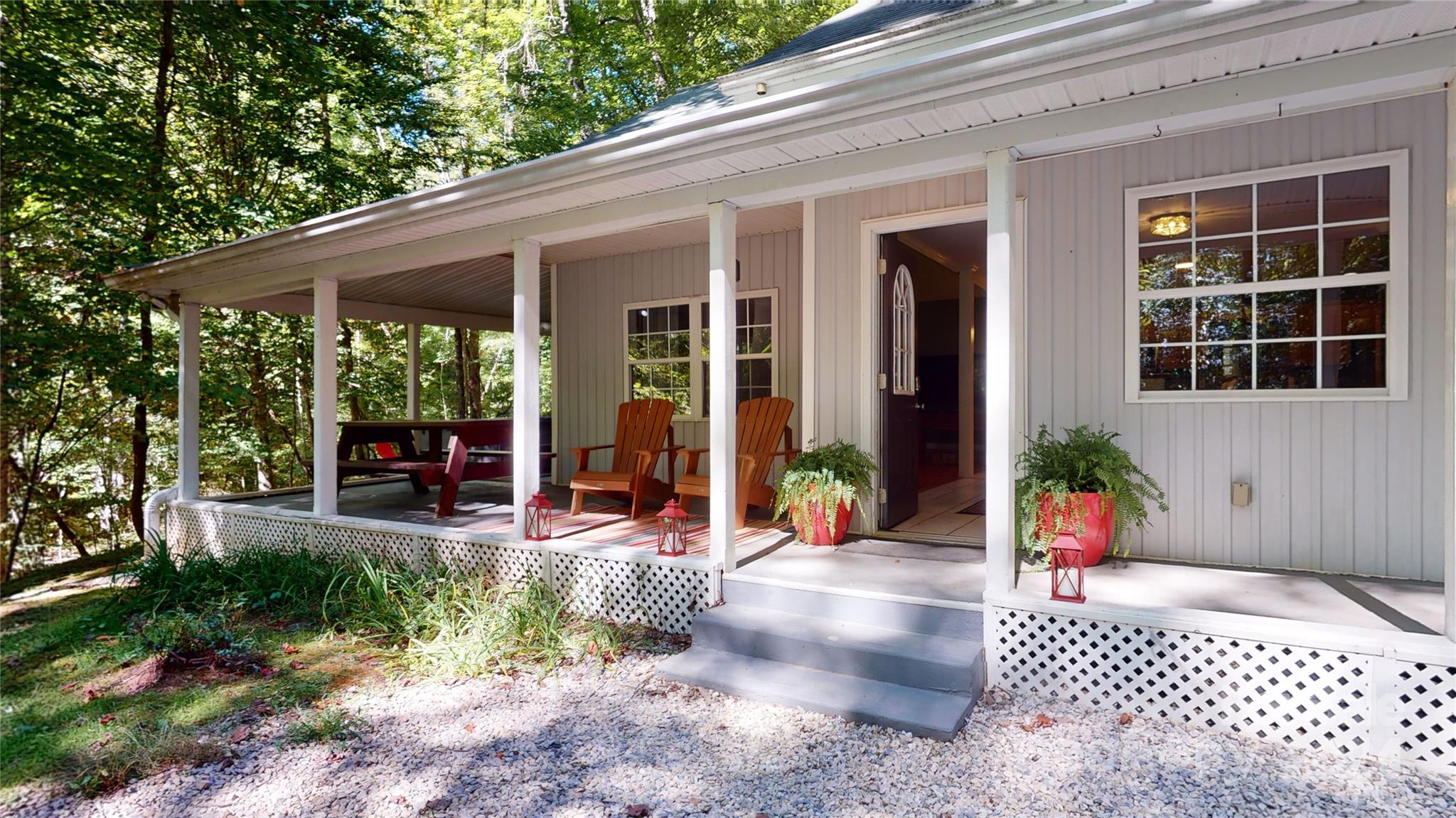 a view of a house with backyard and porch