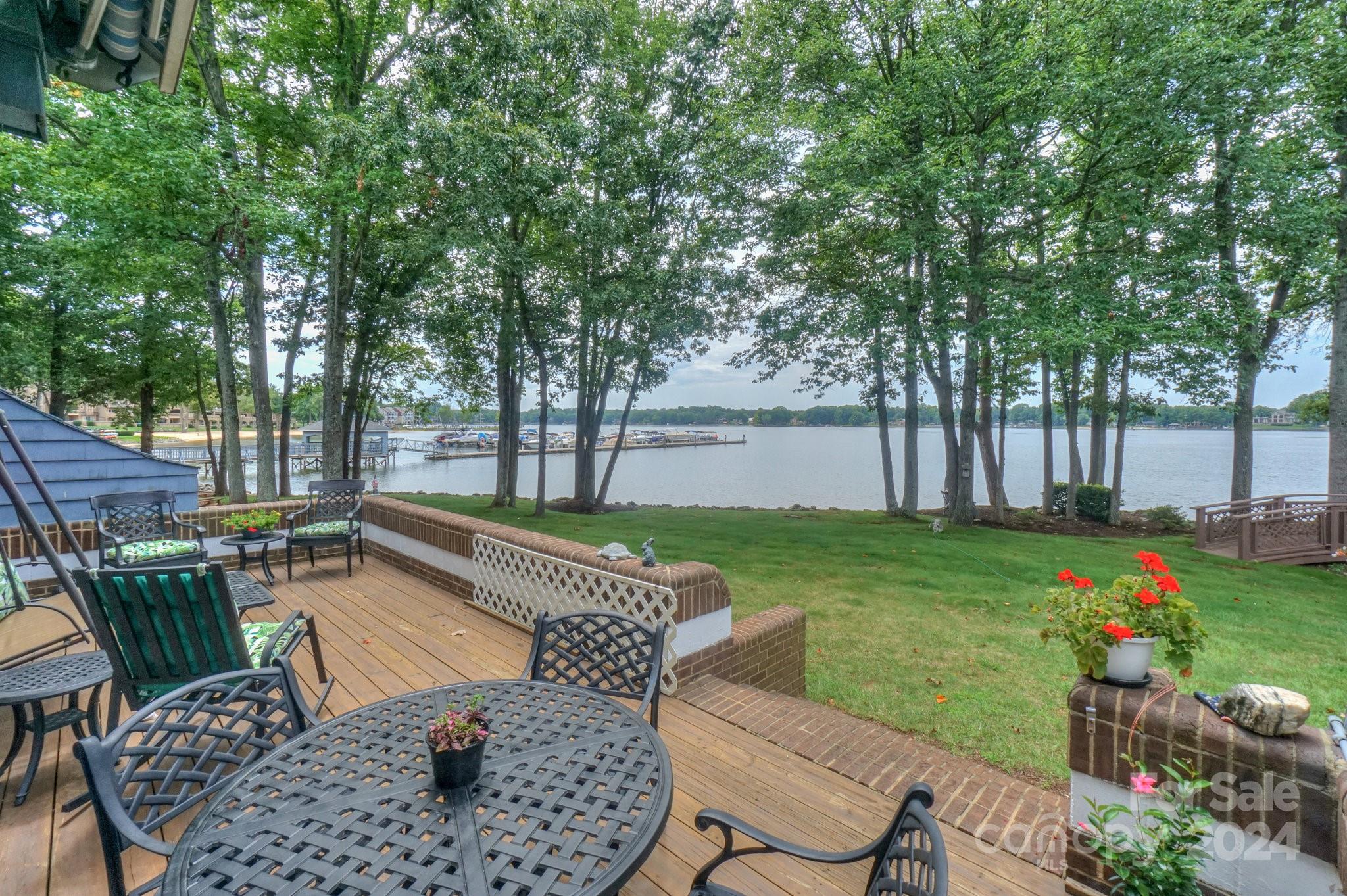 a view of a backyard with sitting area