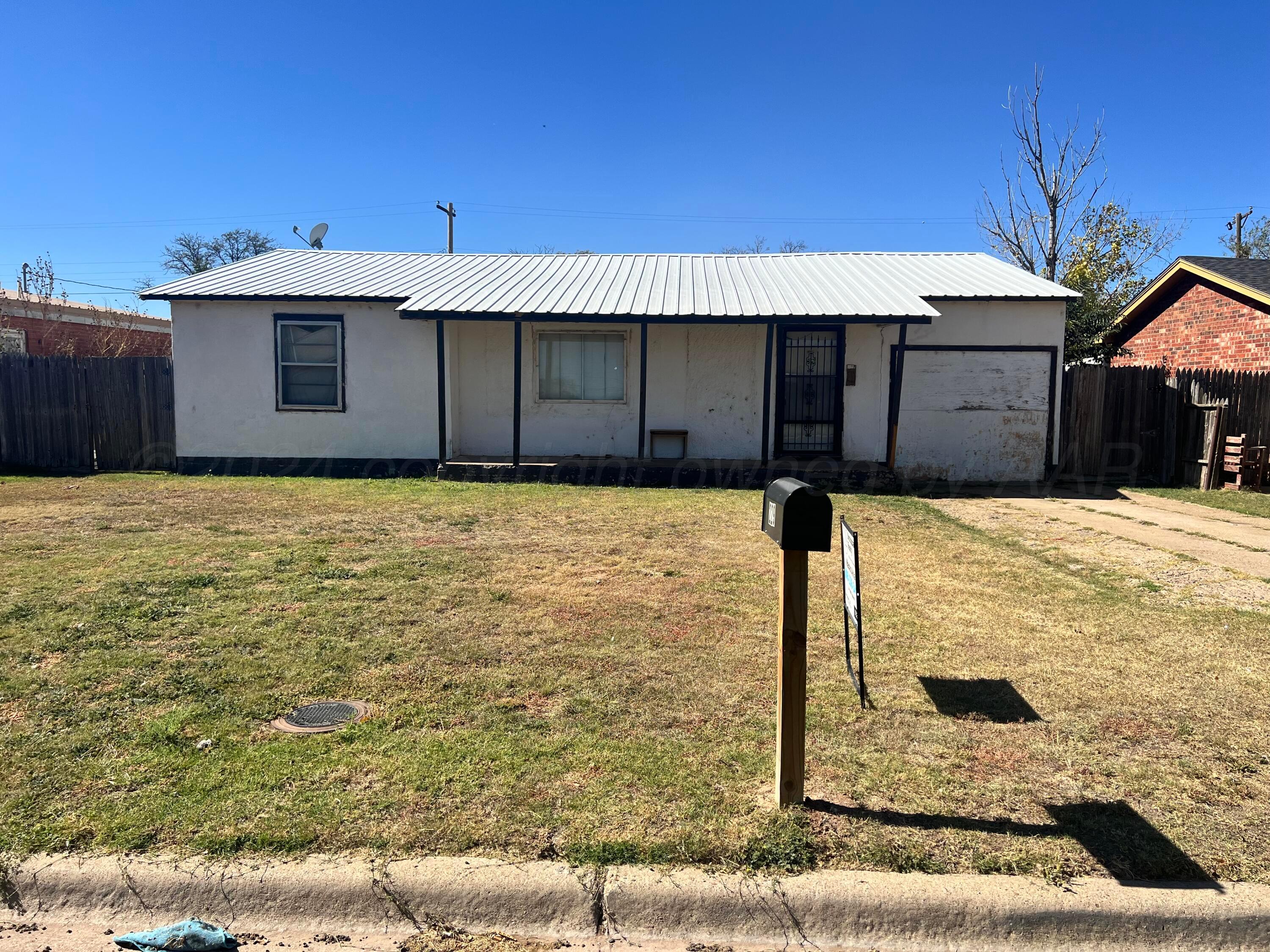 a front view of a house with yard