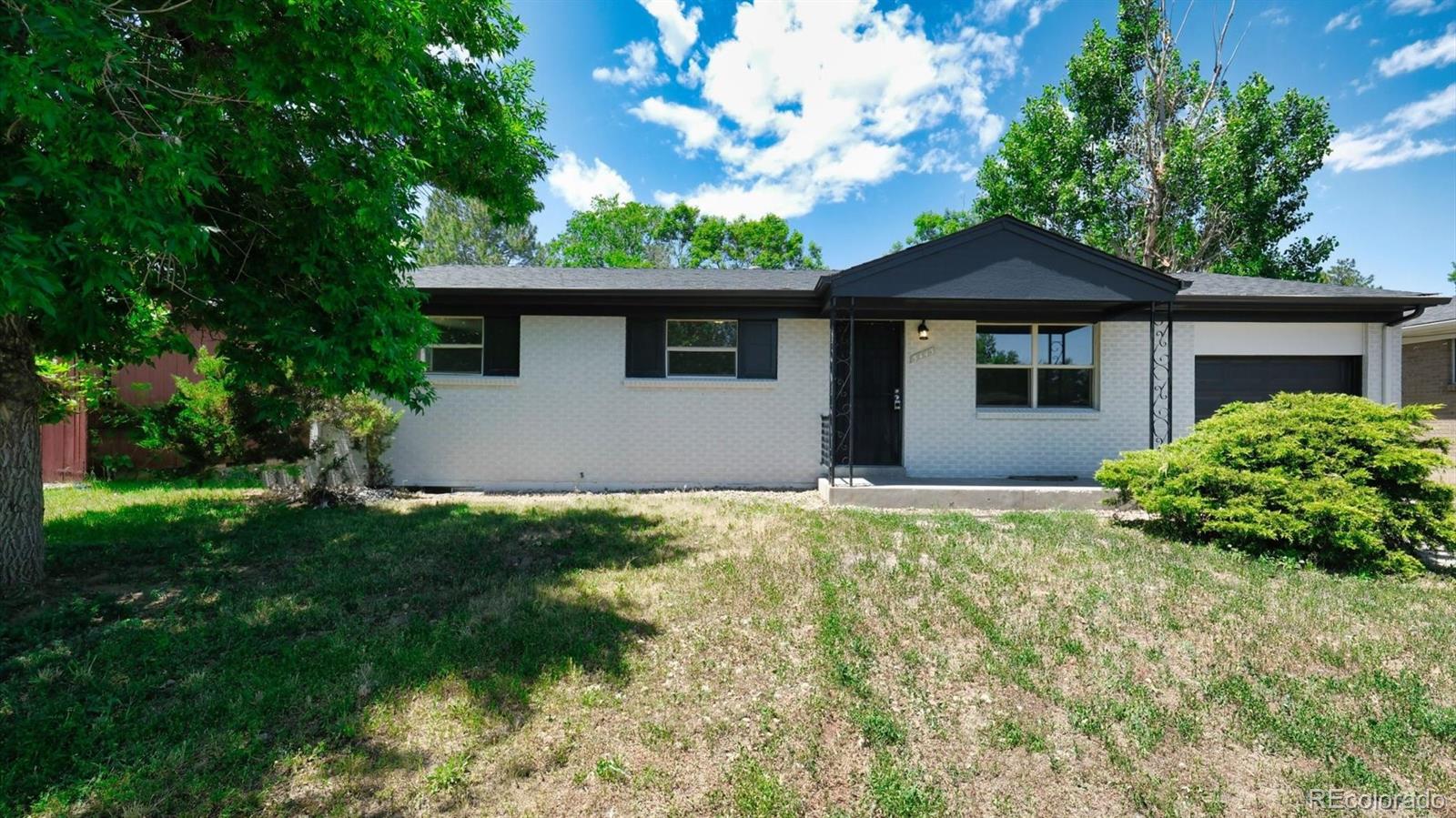 front view of a house with a yard