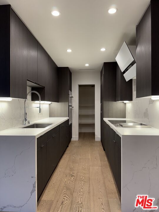 a bathroom with a sink double vanity and a large mirror