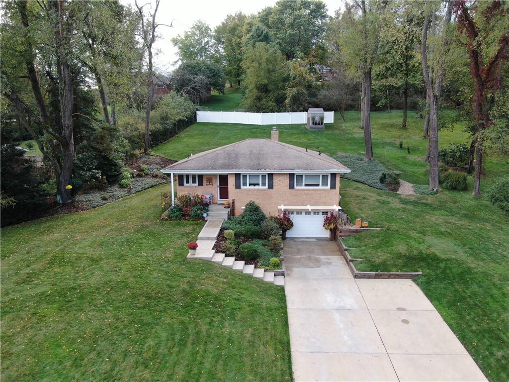 a aerial view of a house with garden