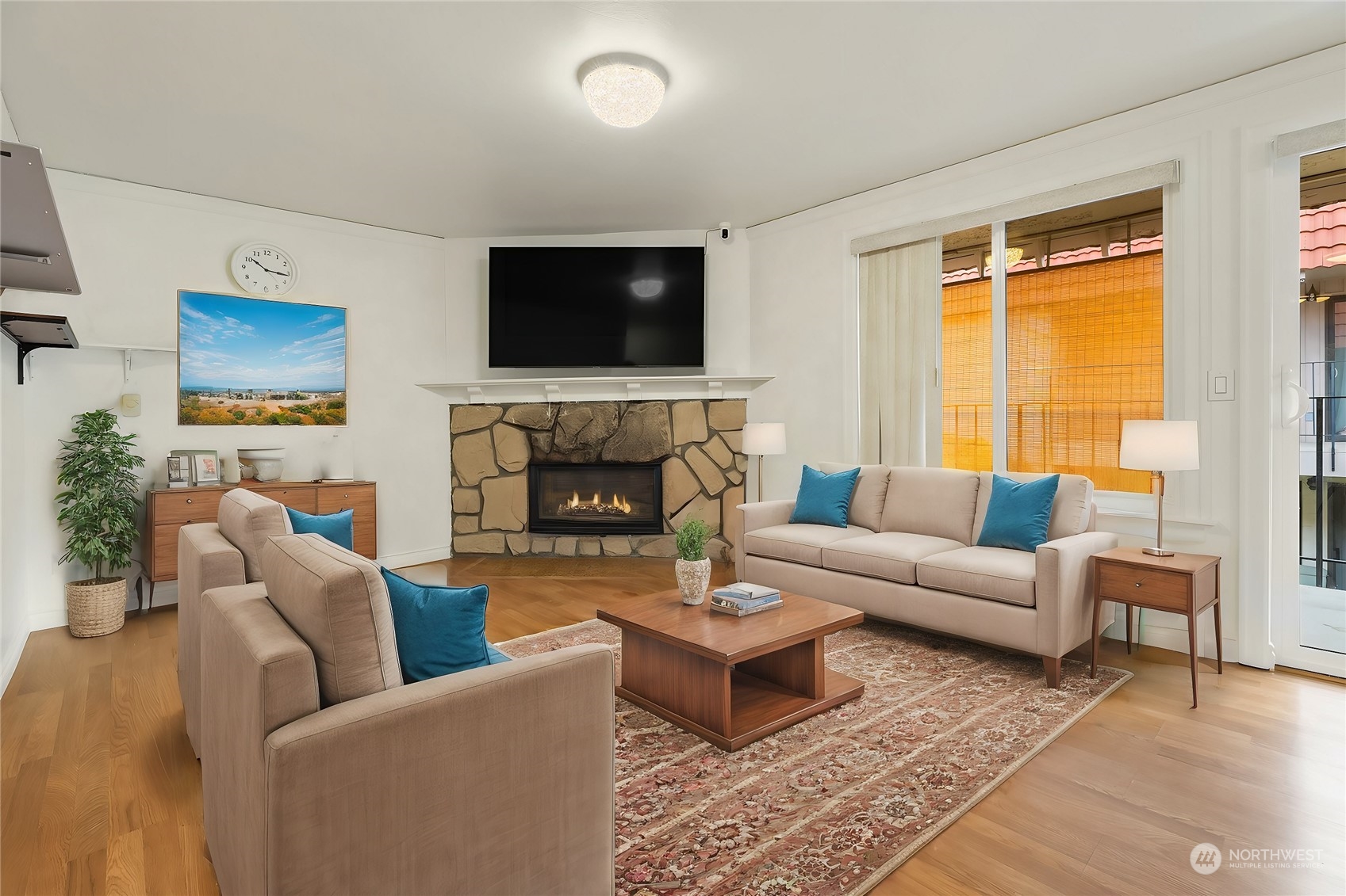 a living room with furniture fireplace and a flat screen tv