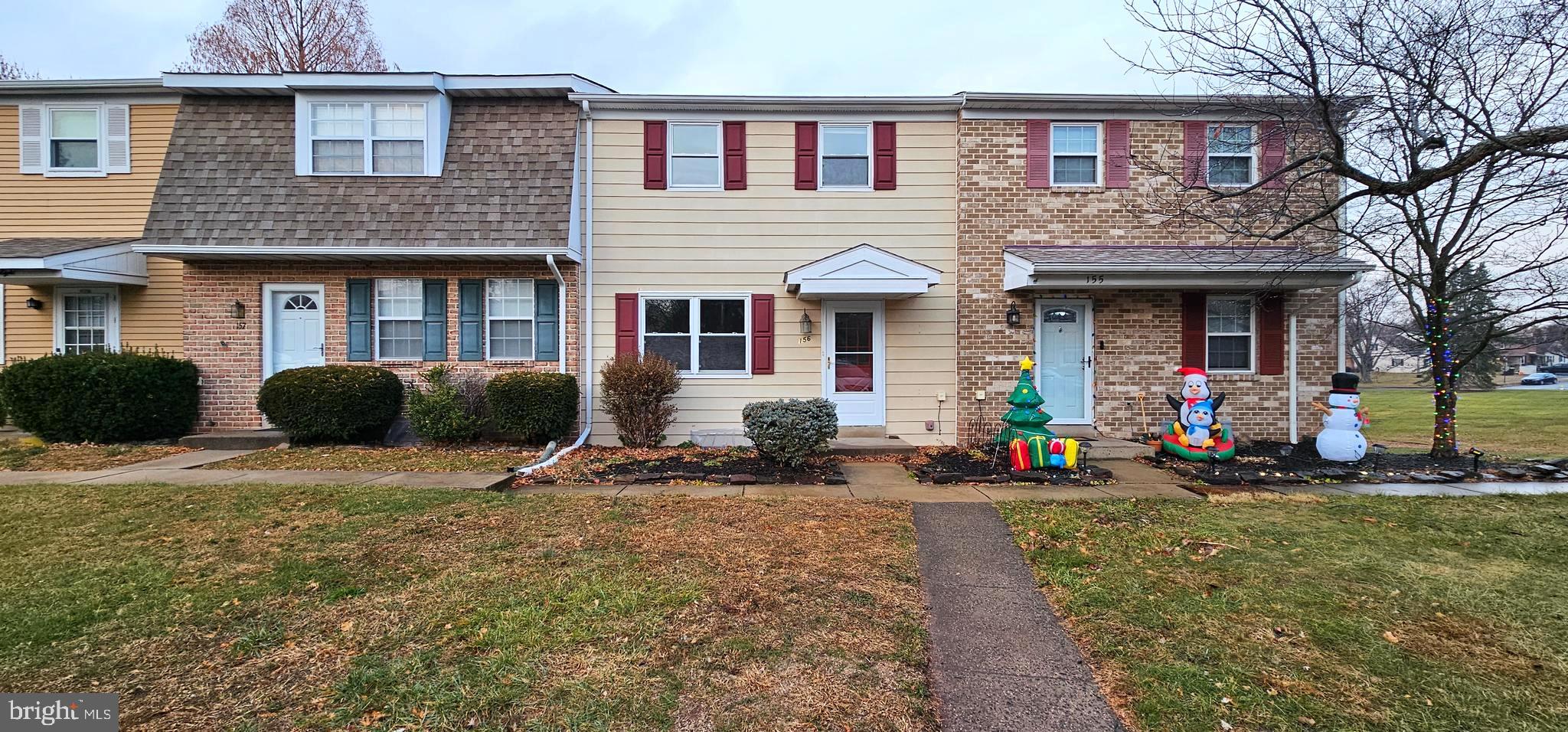 a front view of a house with garage