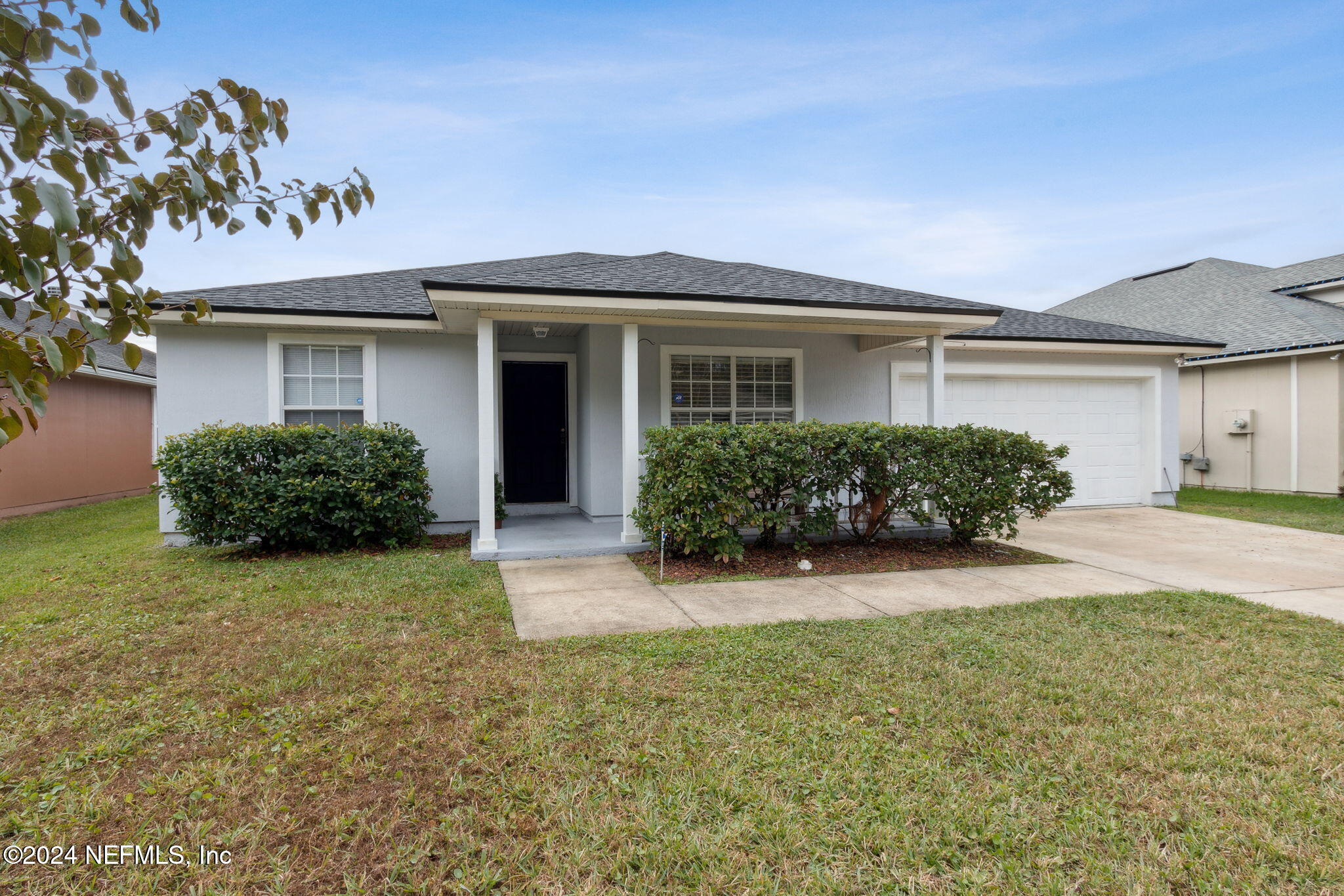 front view of a house with a yard