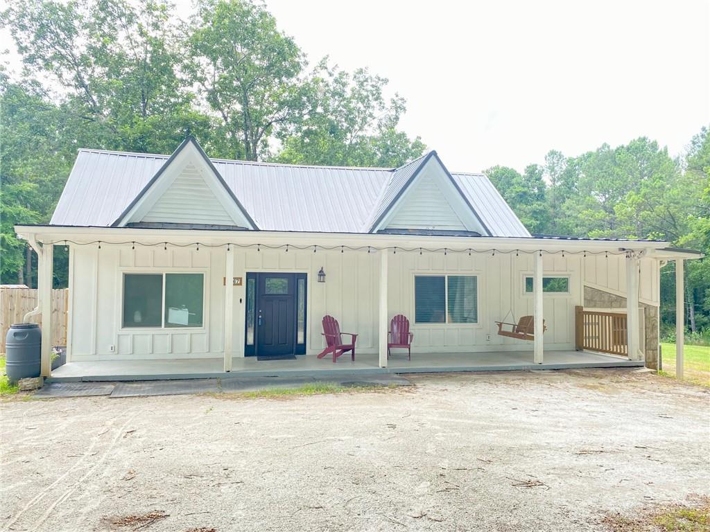 a front view of a house with swing