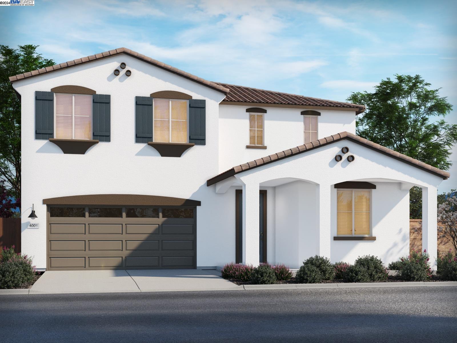 a front view of a house with garage