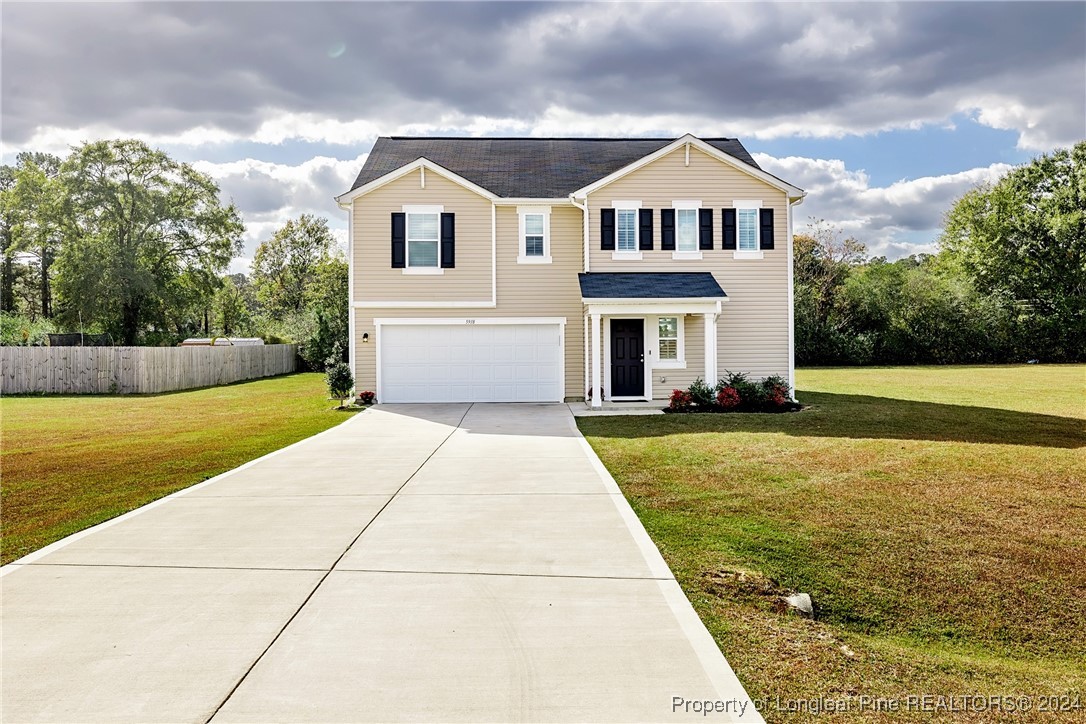 a front view of a house with yard