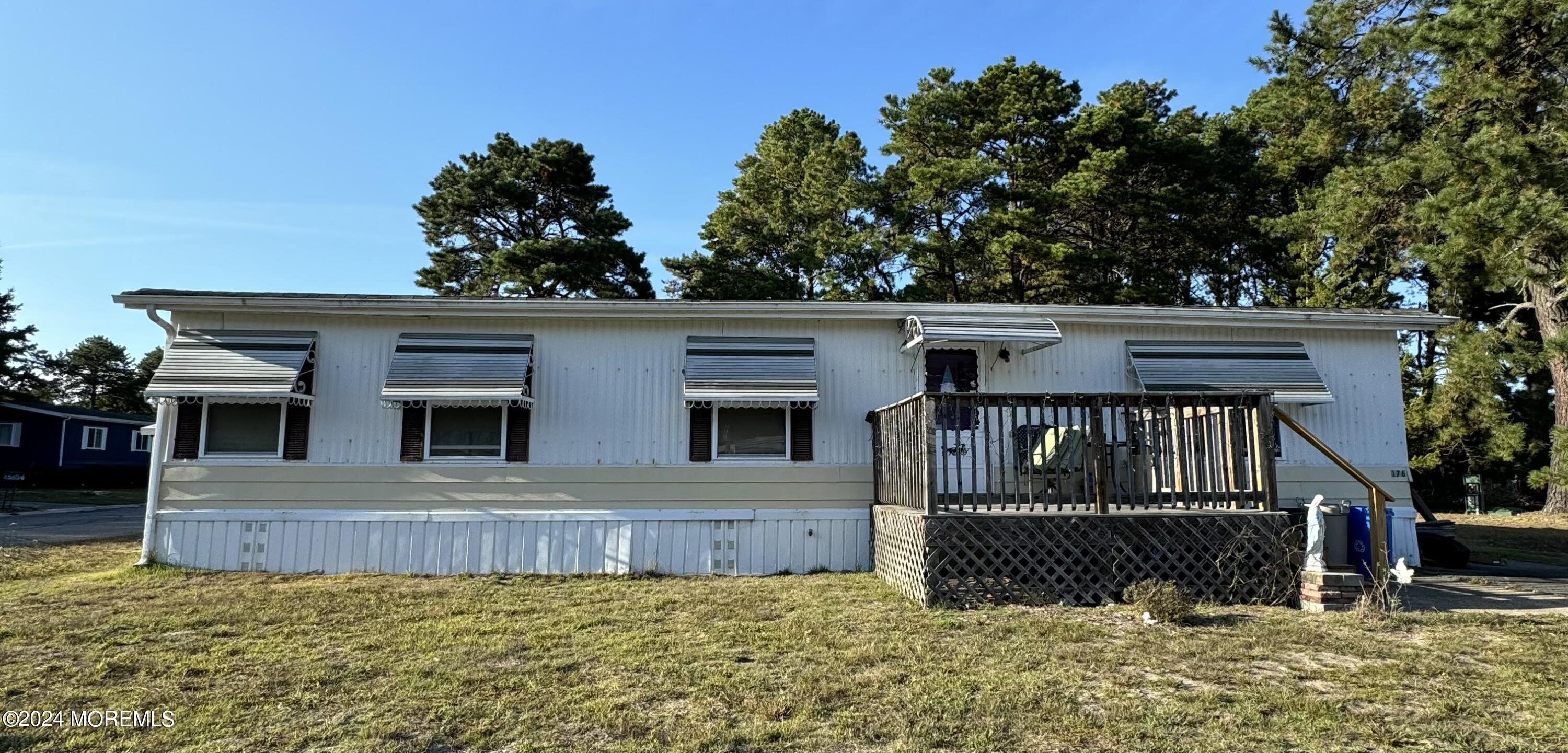 a view of a house with wooden fence