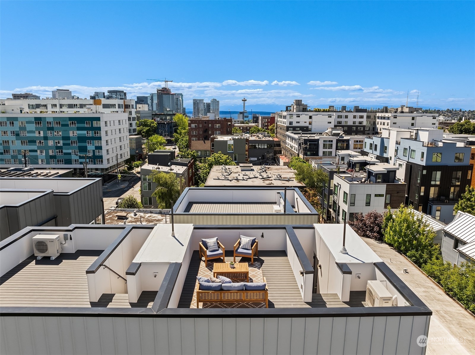 a view of a balcony with furniture and city view