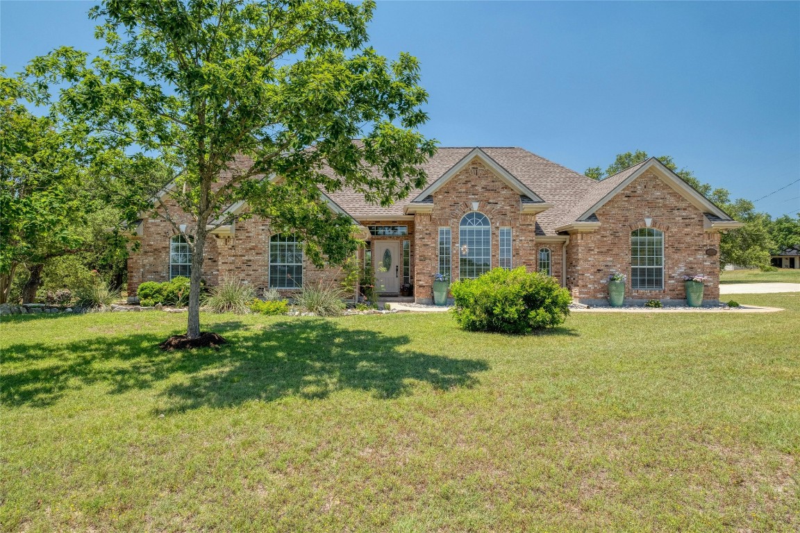 front view of a house with a yard