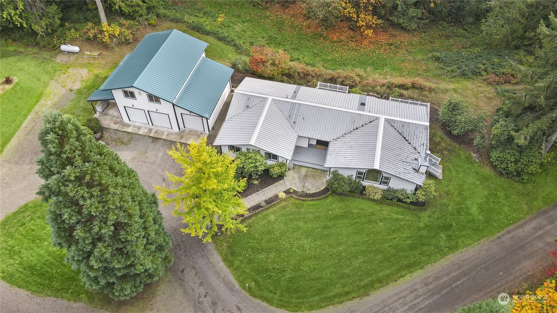 an aerial view of a house with garden