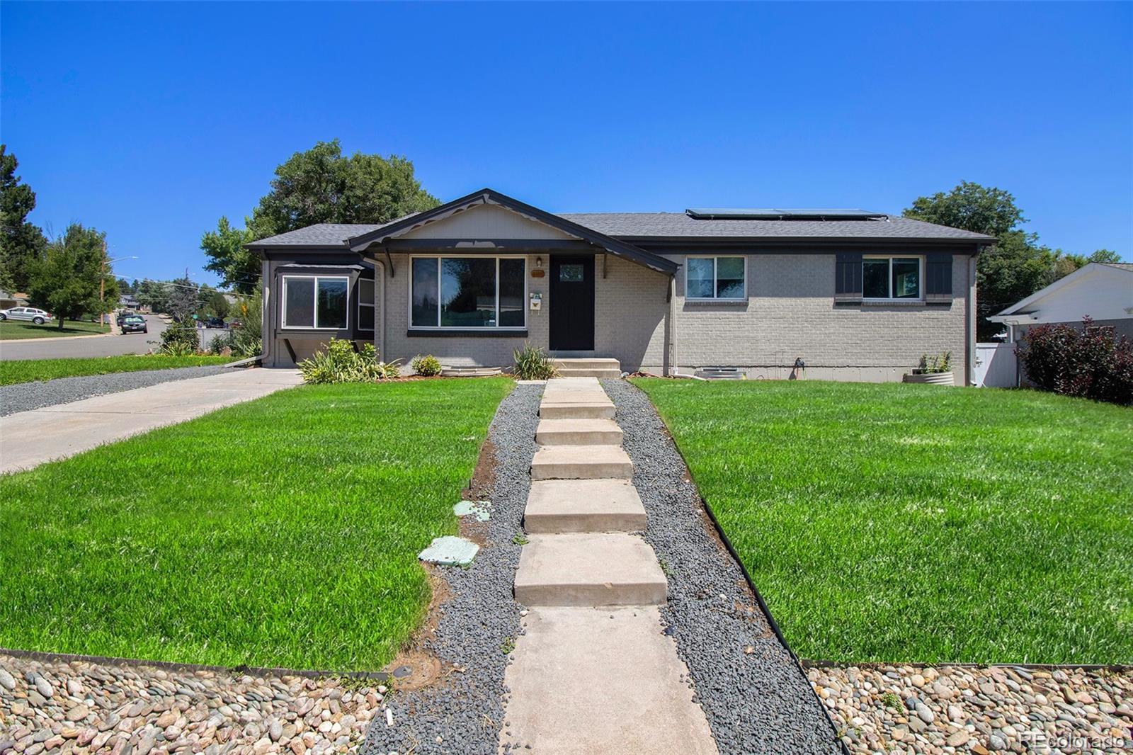 a front view of a house with yard