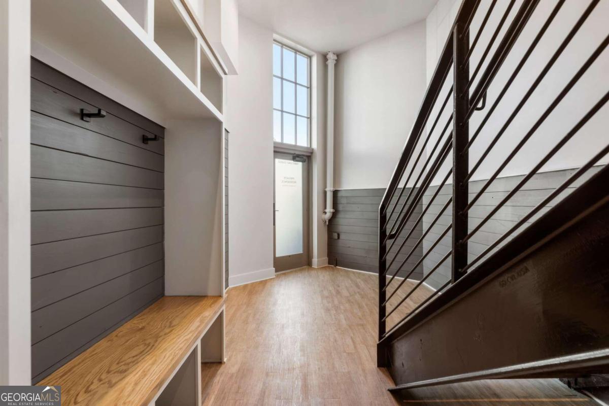 a view of an entryway with wooden floor