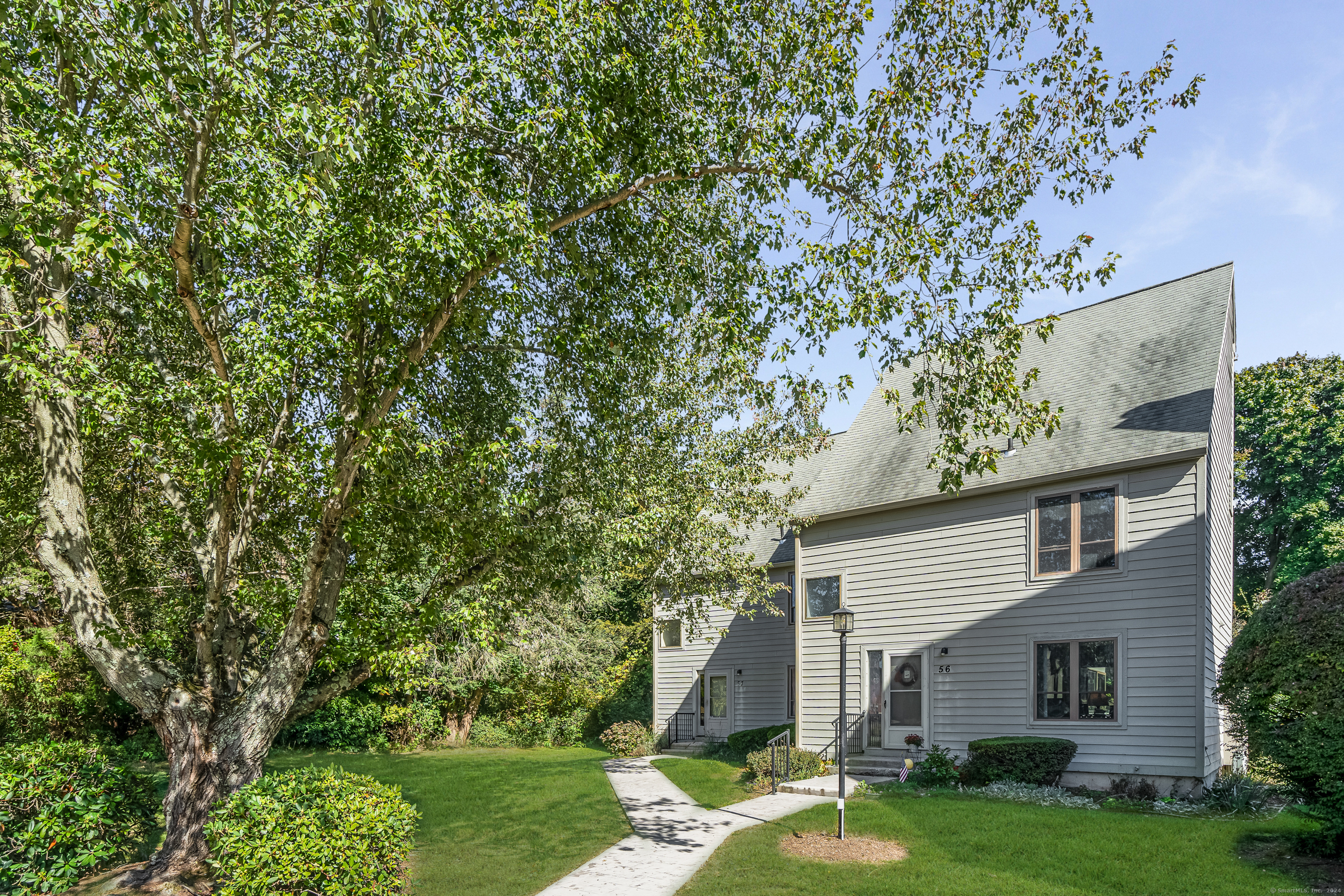 front view of a house with a yard