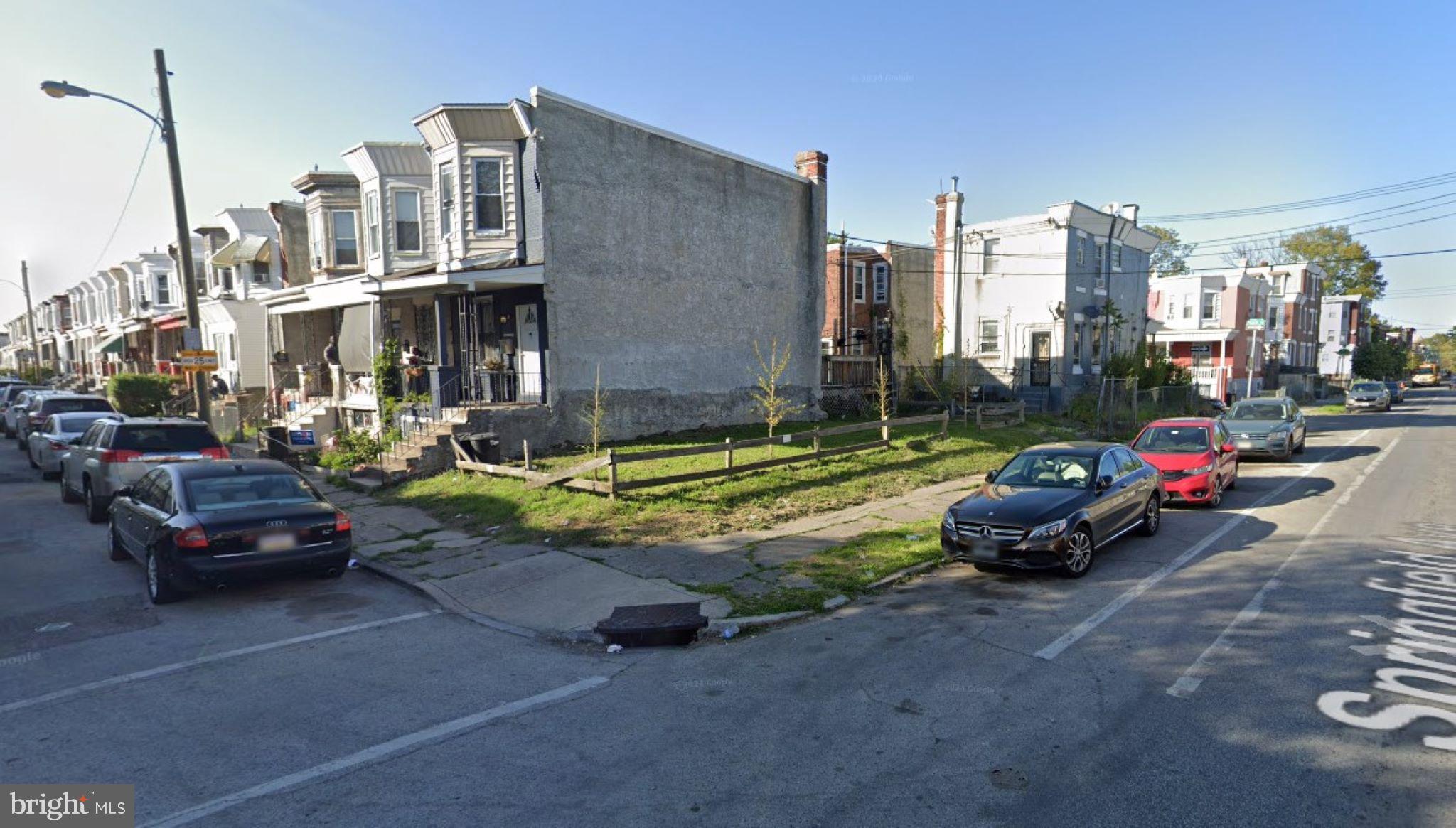 a view of a cars park in front of a house