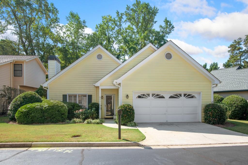 a front view of a house with garage