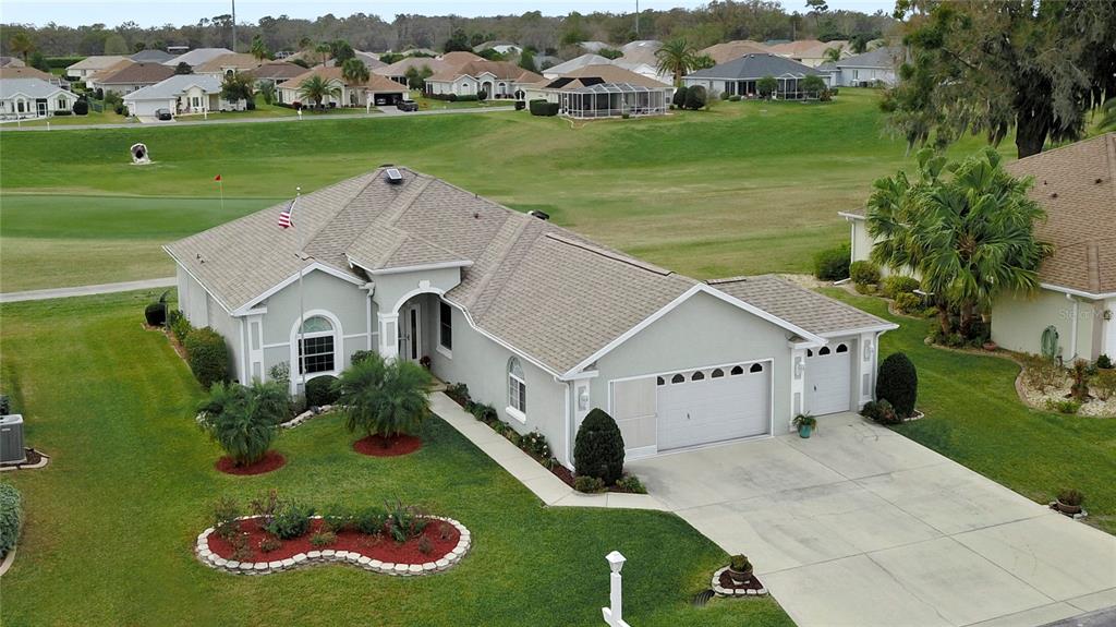 an aerial view of a house with a garden view