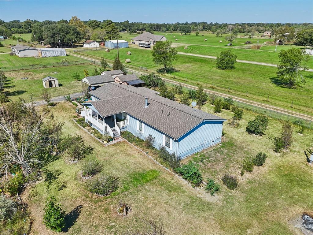 a view of a big house with a big yard