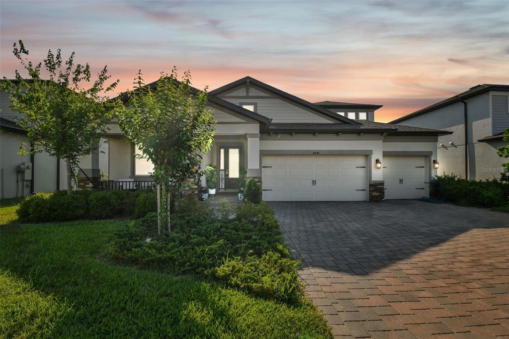 a front view of house with a garden