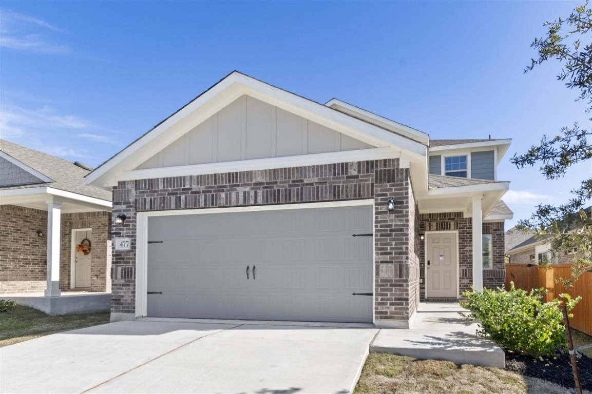 a view of a house with a garage