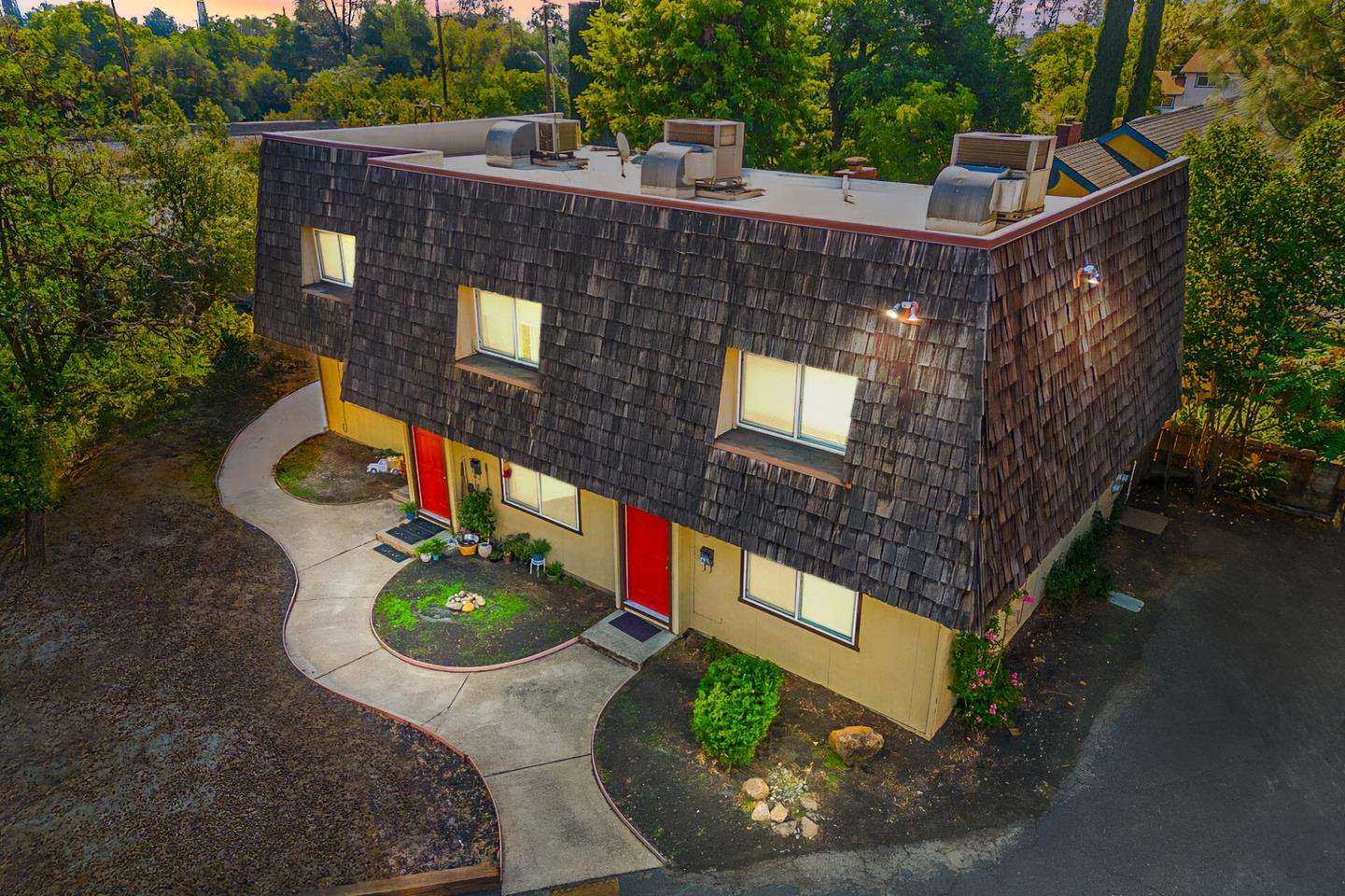 a aerial view of a house with a yard