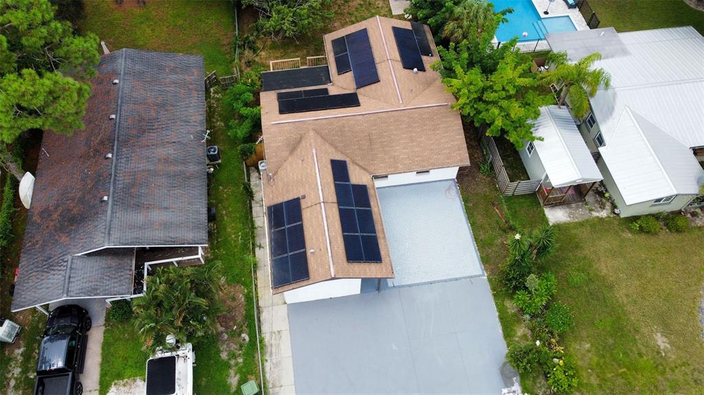 an aerial view of house with yard