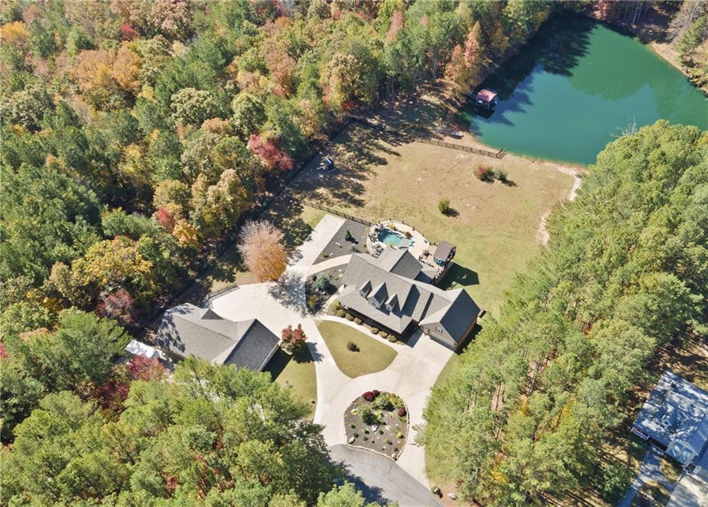 an aerial view of a house with yard and street view