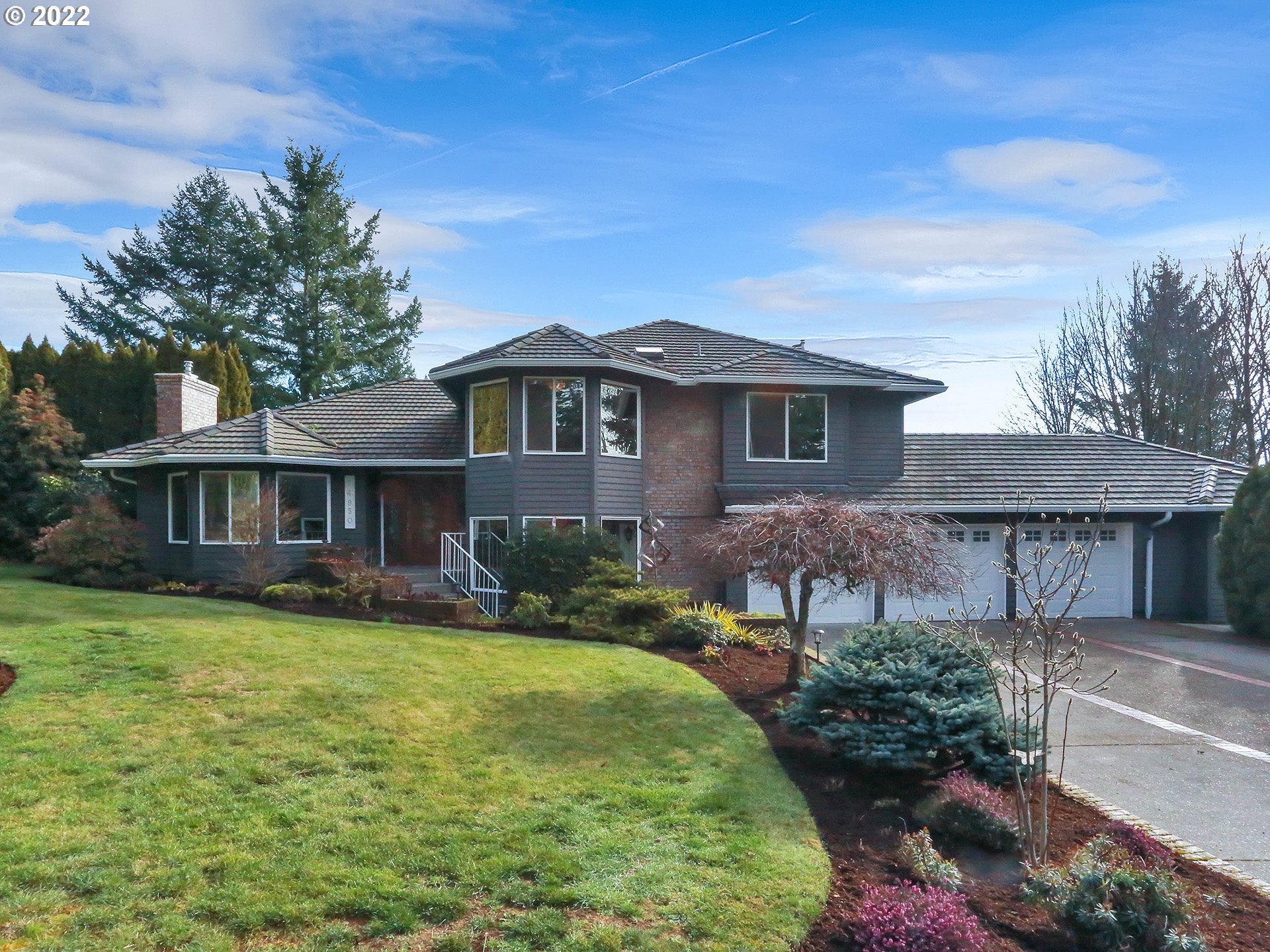 a front view of a house with garden