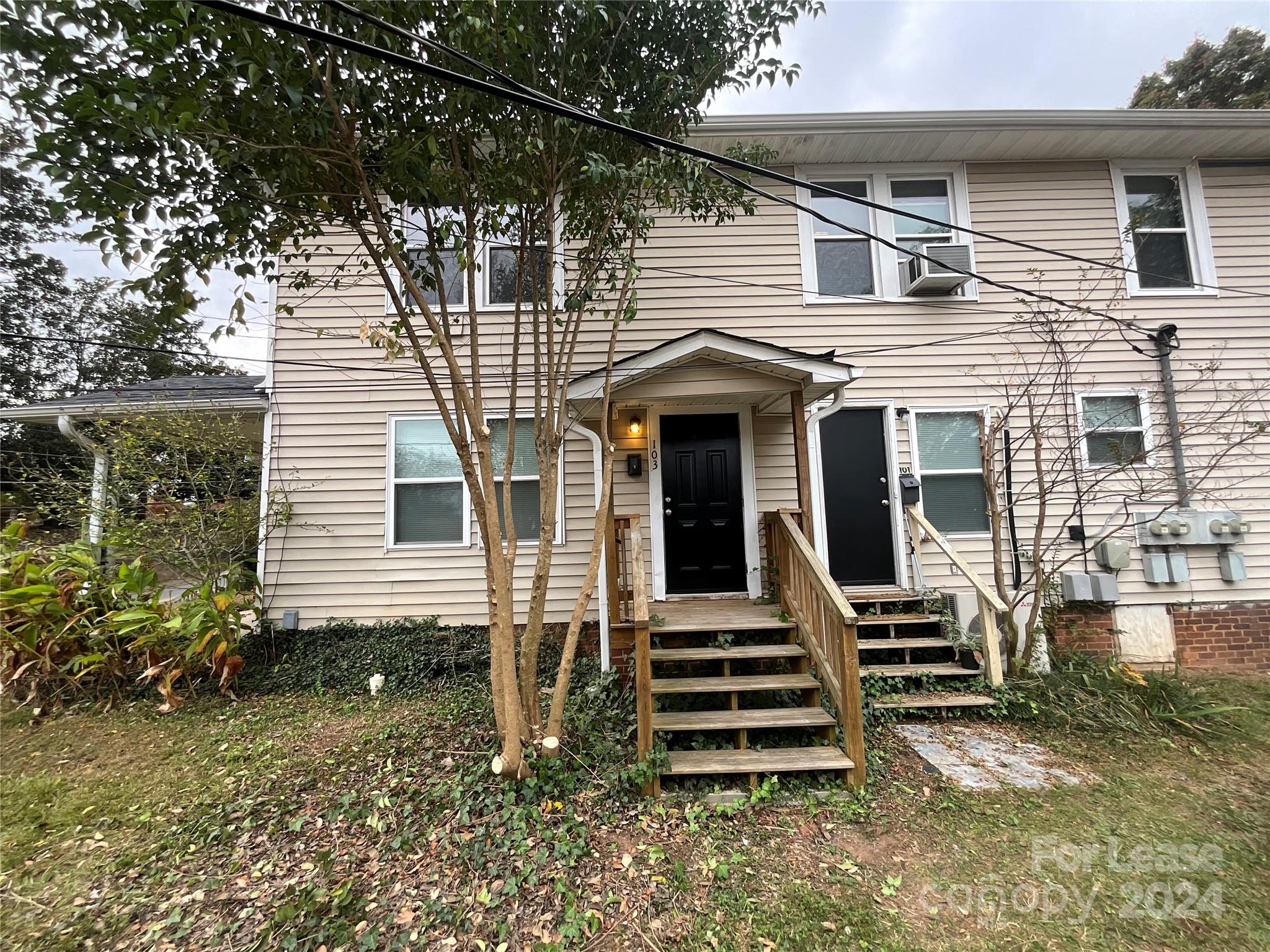 a front view of a house with stairs