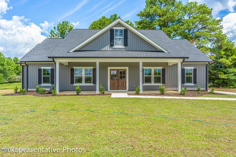 front view of a house with a yard