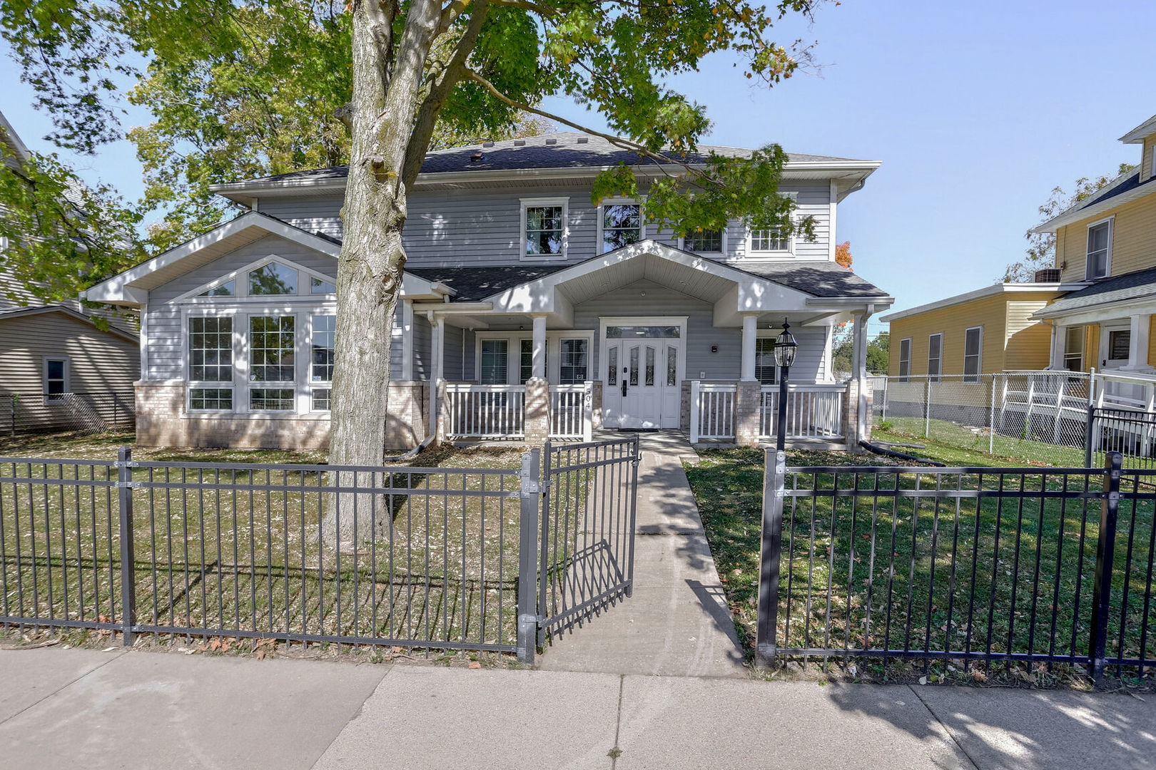 a front view of a house with a garden