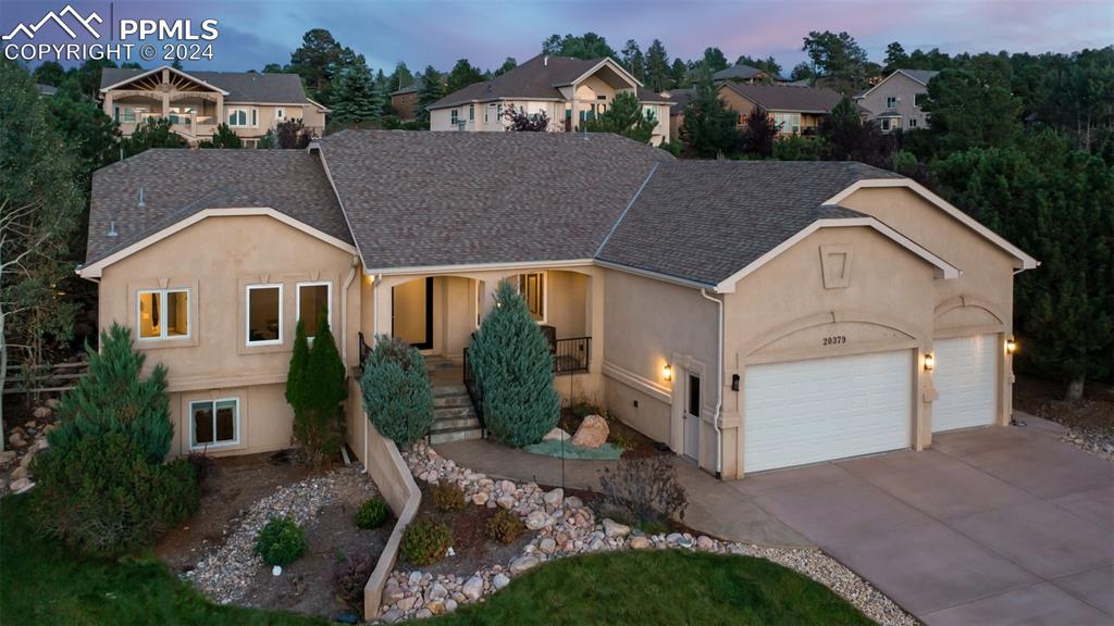 Immaculate Stucco rancher with finished basement, three car garage, and fantastic outdoor living space.