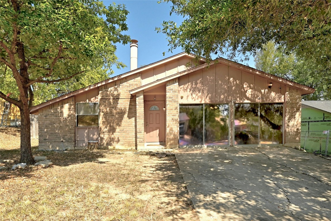 a front view of a house with a outdoor space