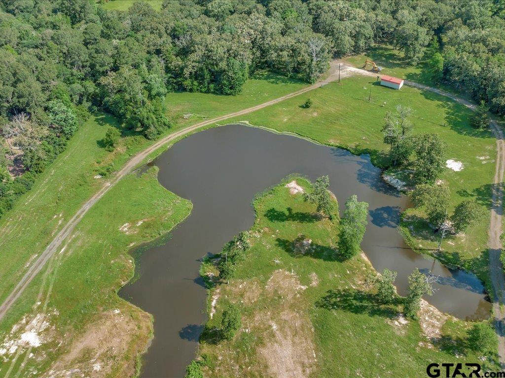 an aerial view of a golf course with swimming pool