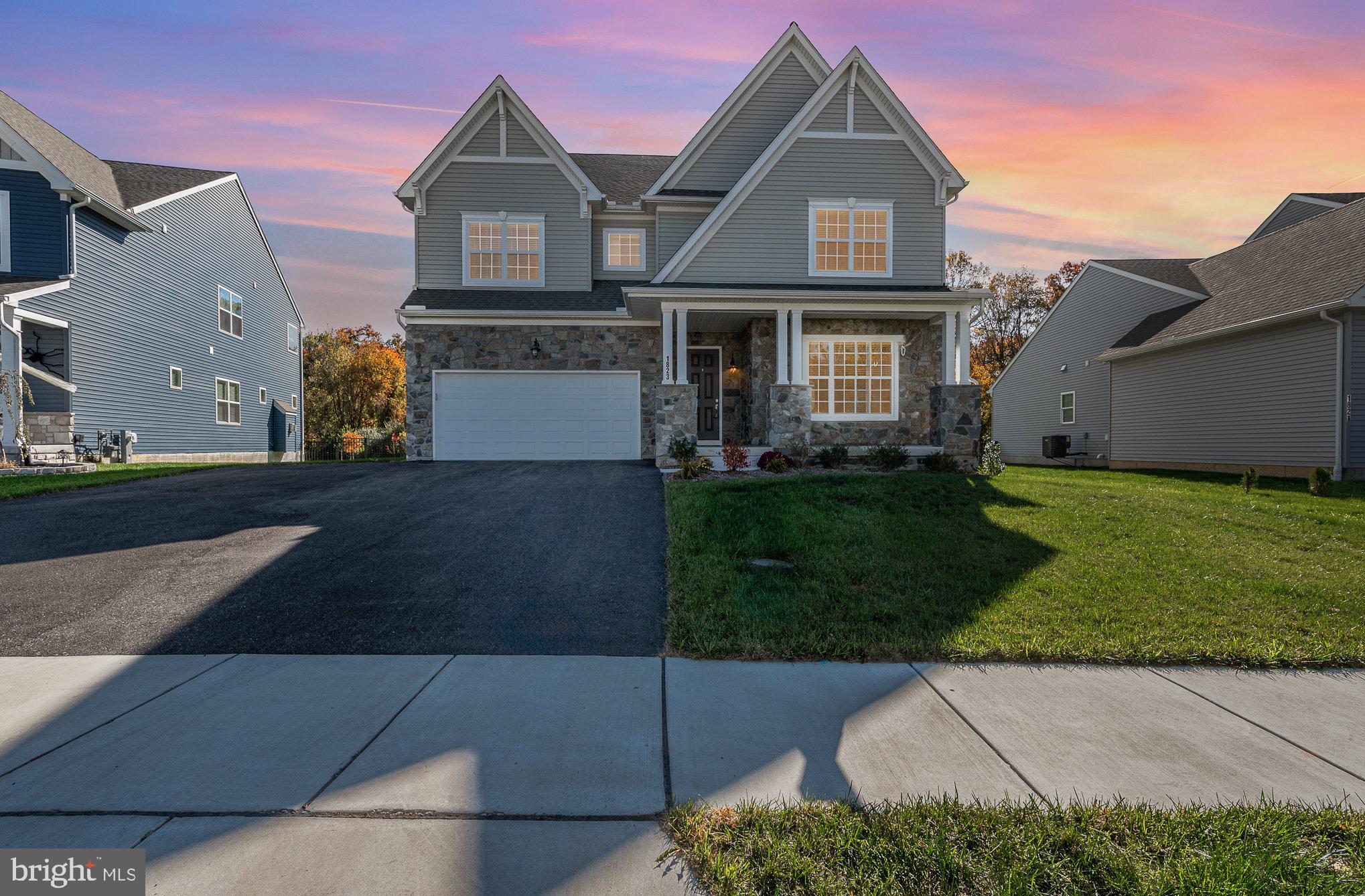 a view of a brick house with a yard